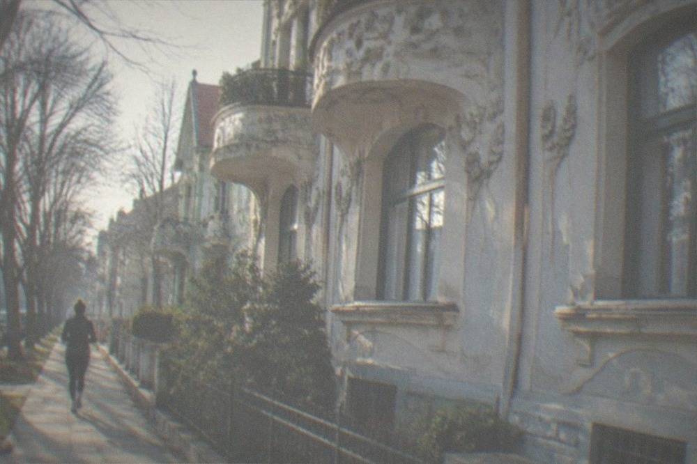 Close view of a restored Art Nouveau facade with curved balconies and floral stucco decoration in Elisabetin