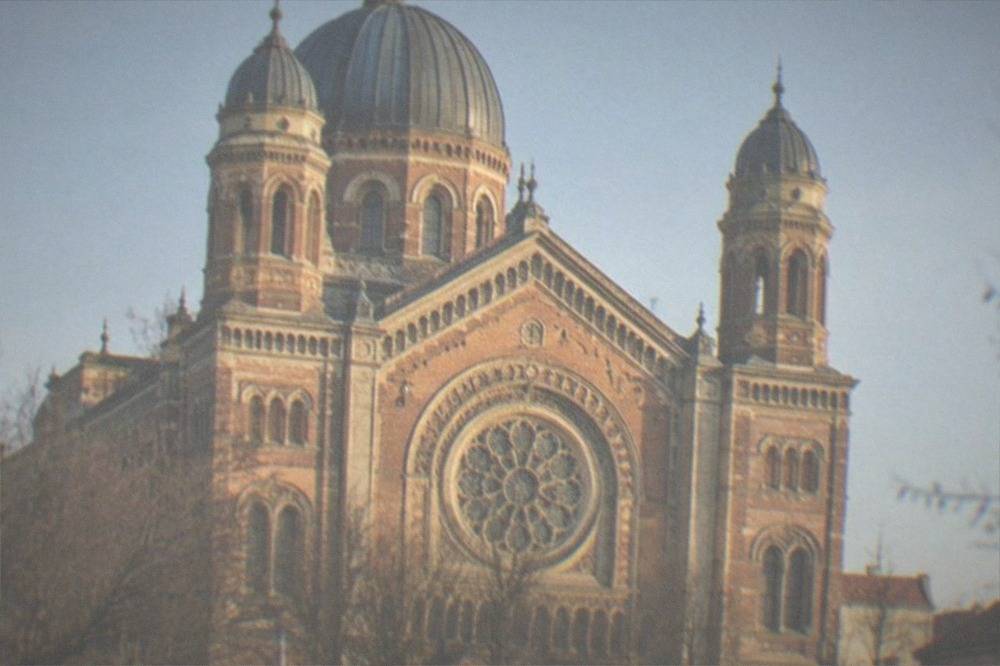 The restored dome and facade of the Fabric Synagogue in Timisoara under a clear sky