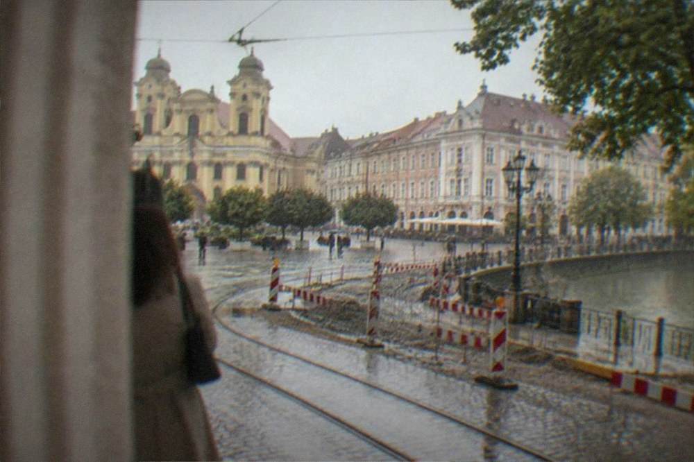 Construction barriers and diverted tram tracks around a historic square in Timisoara