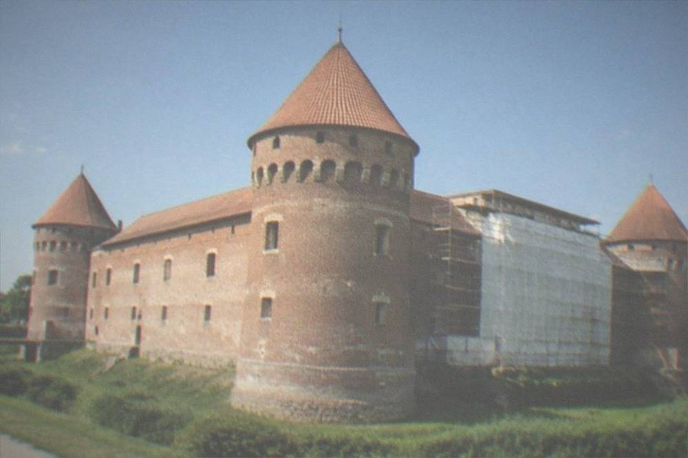 Scaffolding and protective sheeting on part of the castle during restoration works