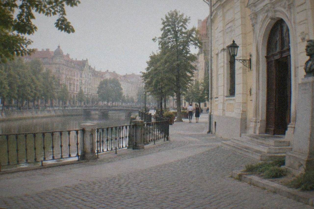 Museum entrance on a quiet Timisoara street with a memorial plaque on the wall