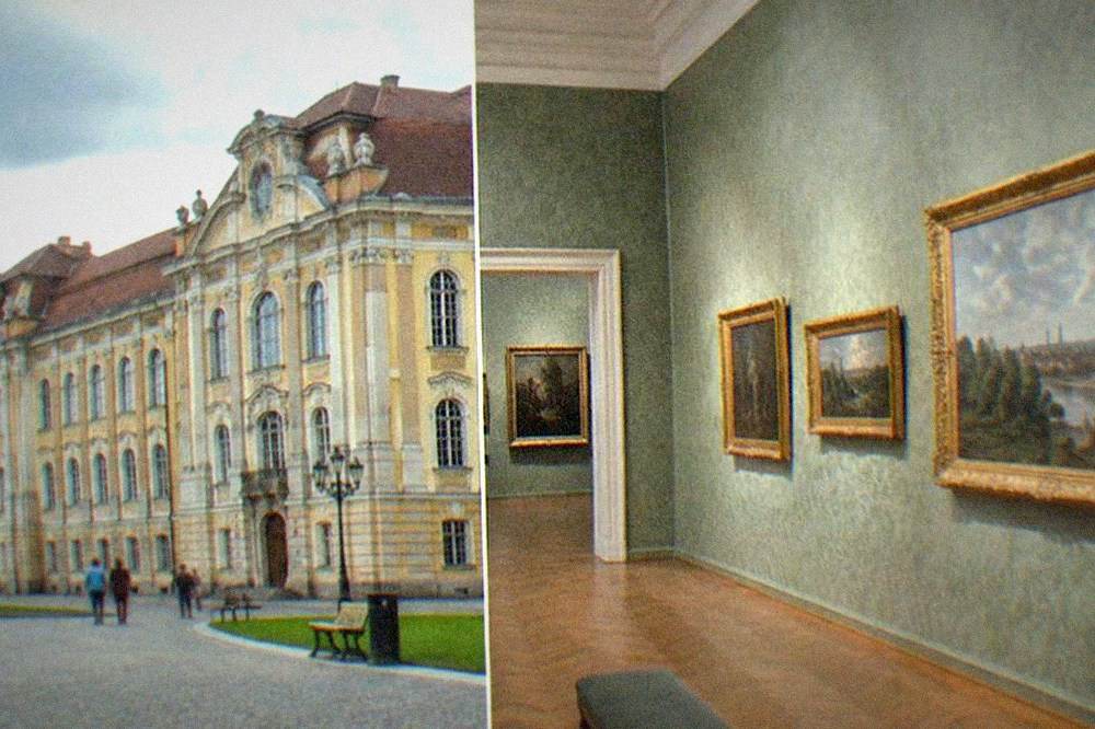 A gallery room with framed European paintings hung on patterned walls inside the museum