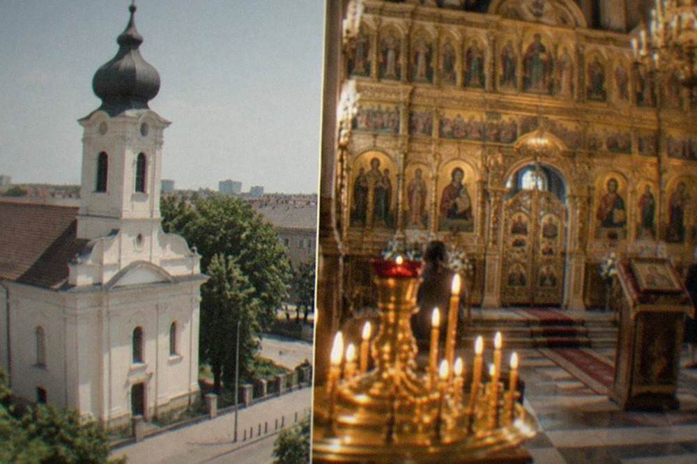 Interior of an Orthodox church with gilded icon screen and rows of candles