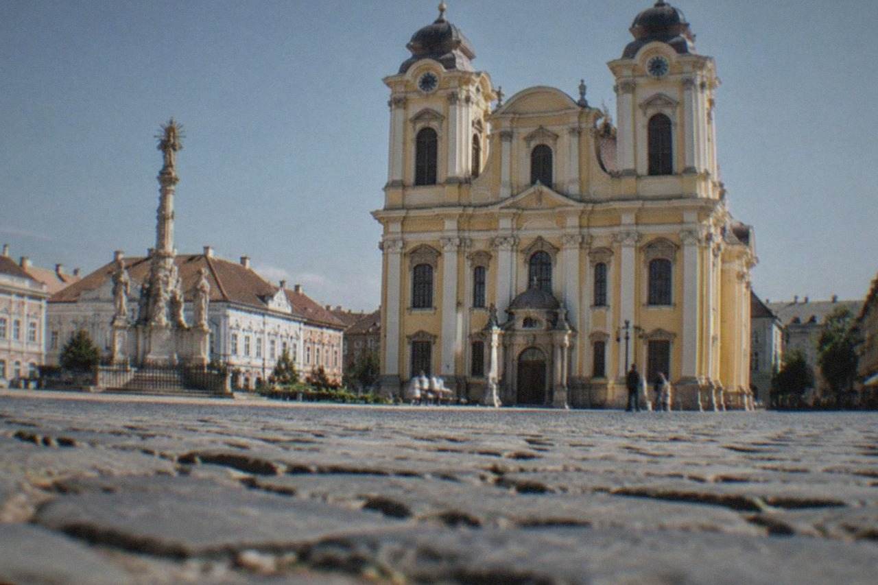 The domed St George Roman Catholic Cathedral seen from Union Square in Timisoara on a bright day