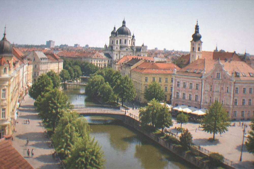 Morning light over the rooftops and domes of central Timisoara seen from above