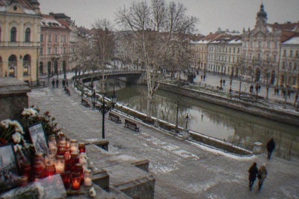 Candlelit memorial corner with photographs and flowers commemorating the December 1989 events in Timisoara