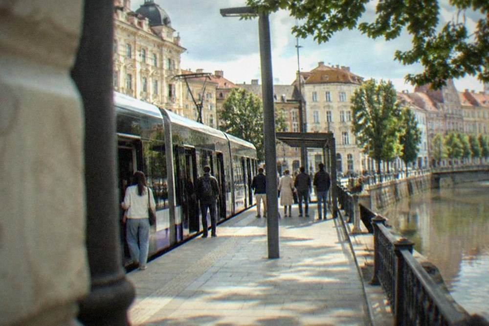 Modern low-floor tram at a stop in central Timisoara with level boarding platform