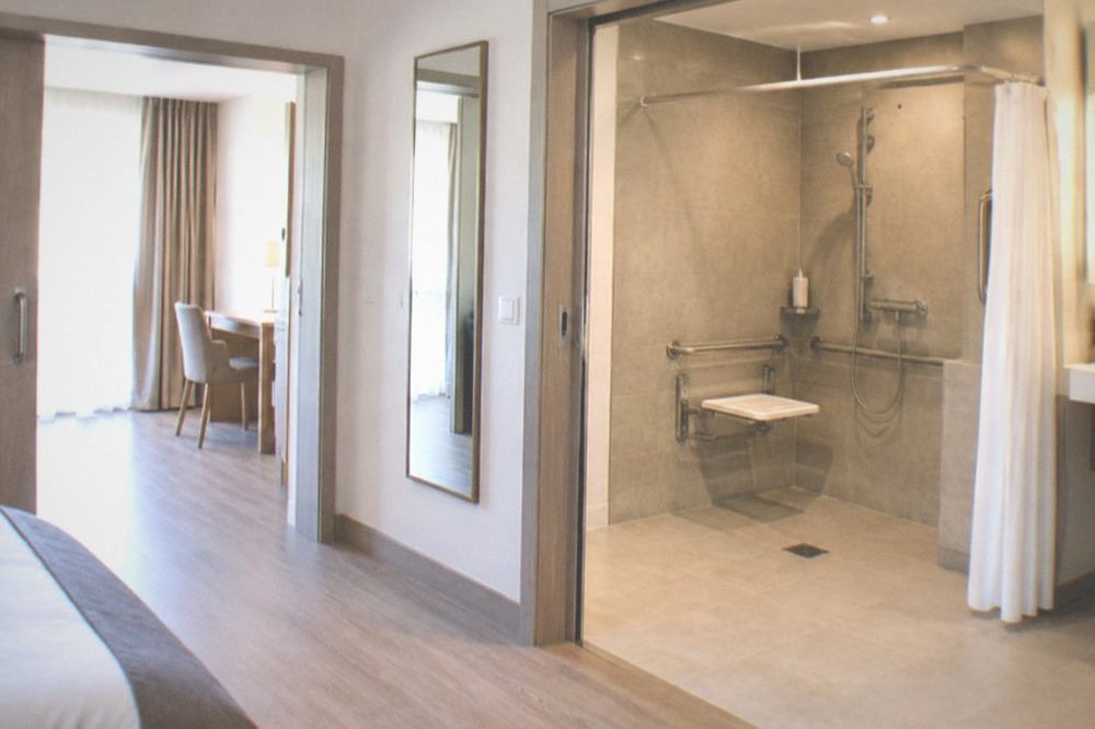 Hotel room with wide doorways and roll-in shower designed for accessible guests