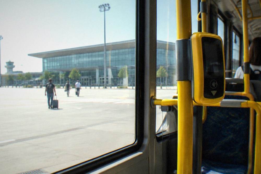 A ticket validation machine inside a modern city tram