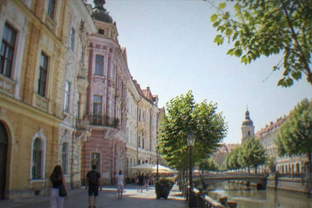 A pedestrian street in Timisoara with historic facades and people walking