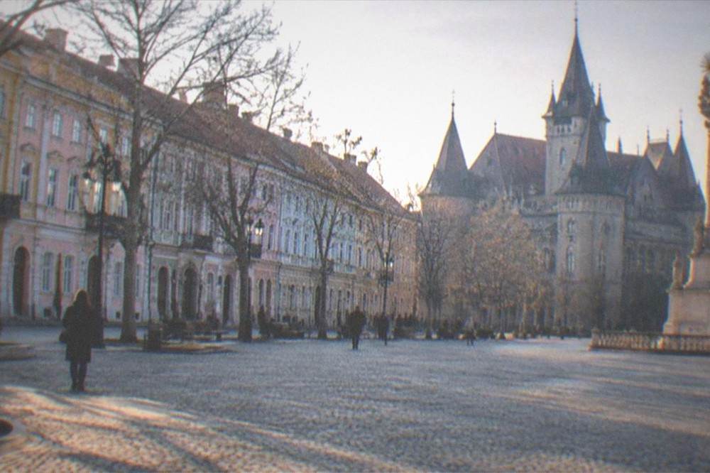A historic castle with Gothic towers and pointed roofs in western Romania