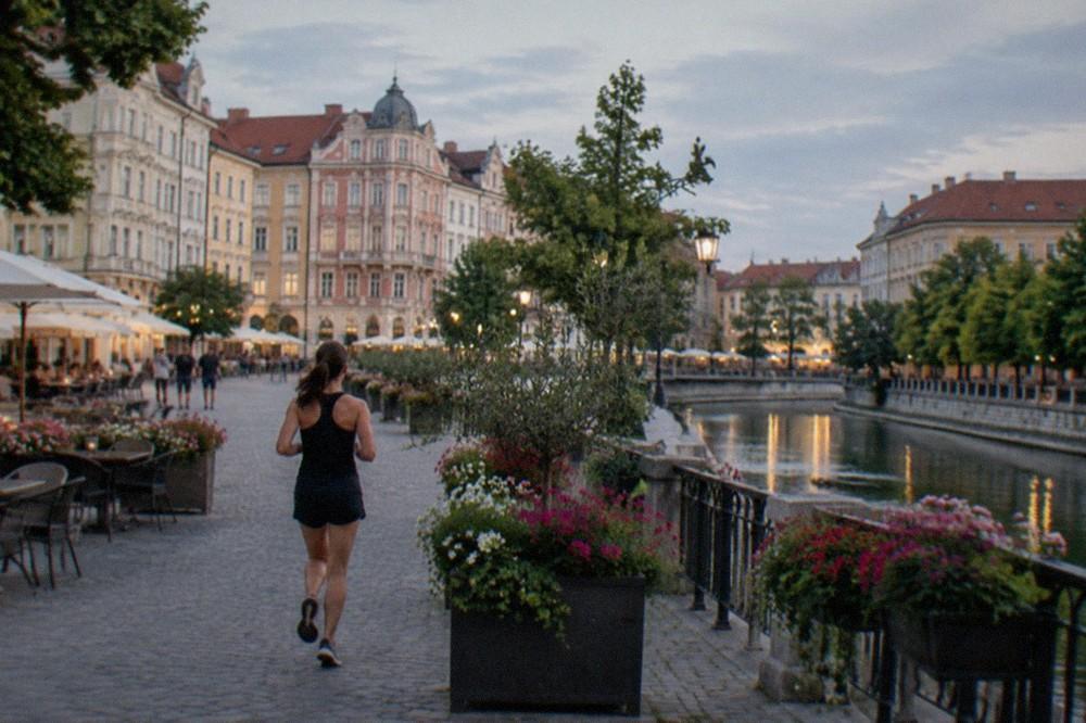 Flowers and outdoor cafe tables in a pedestrian square in Timisoara