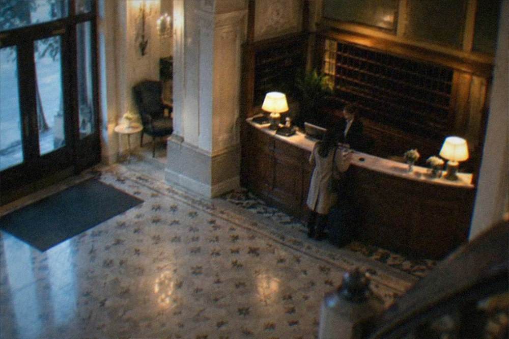 A hotel reception desk in a restored historic building